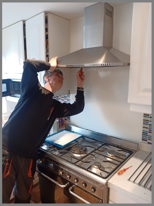 Kitchen hood installer in Edinburgh working safely on commercial ventilation